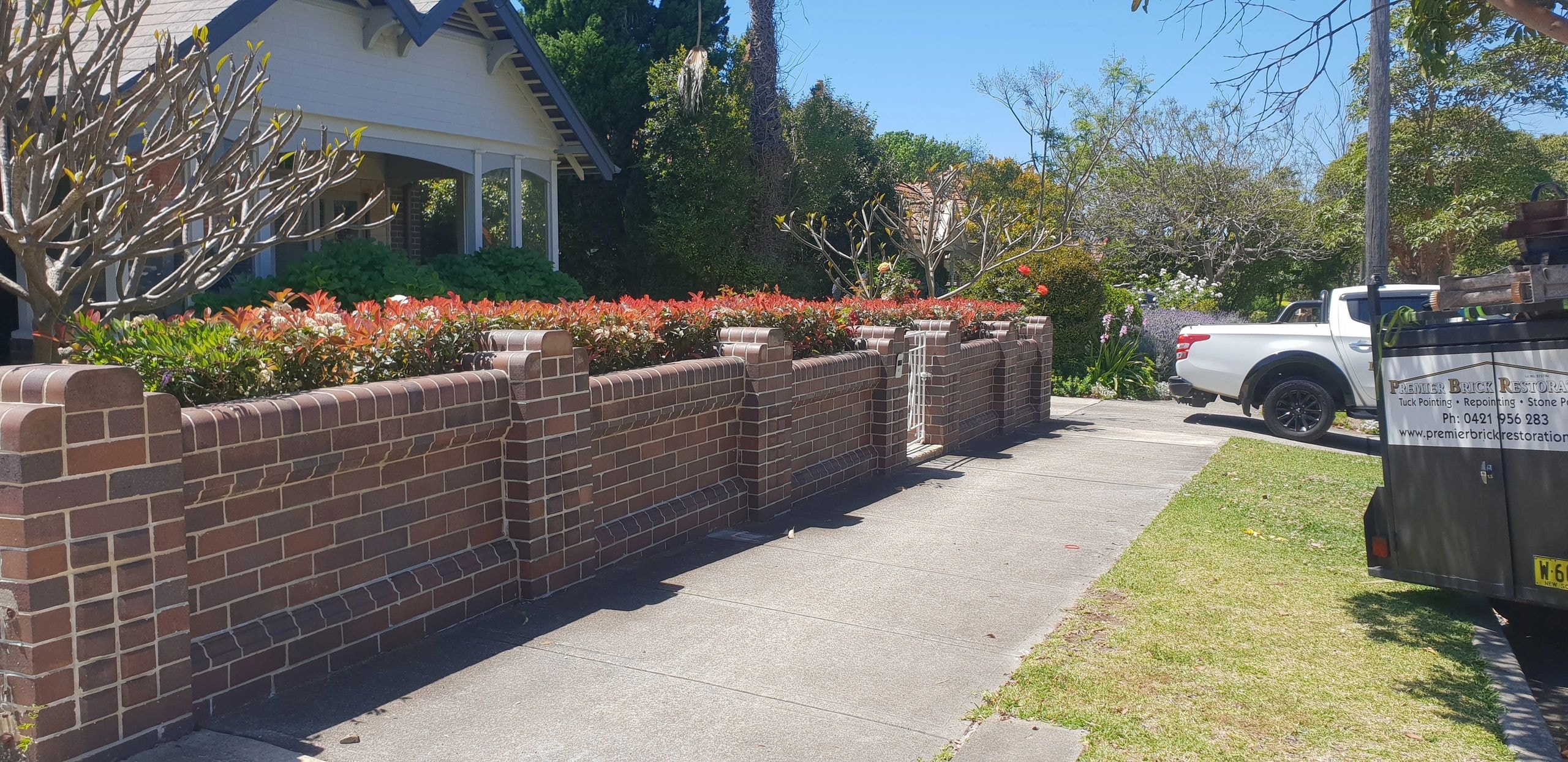 Brick fence and garden — Sydney