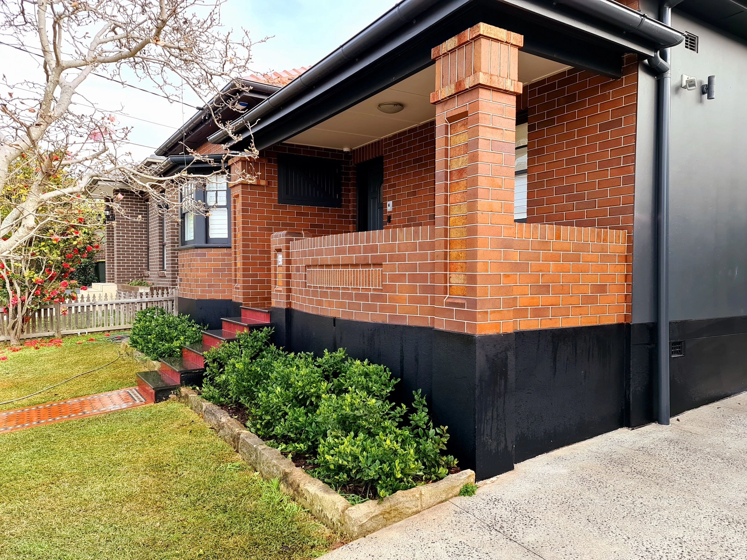 Brick house with black trim — Sydney